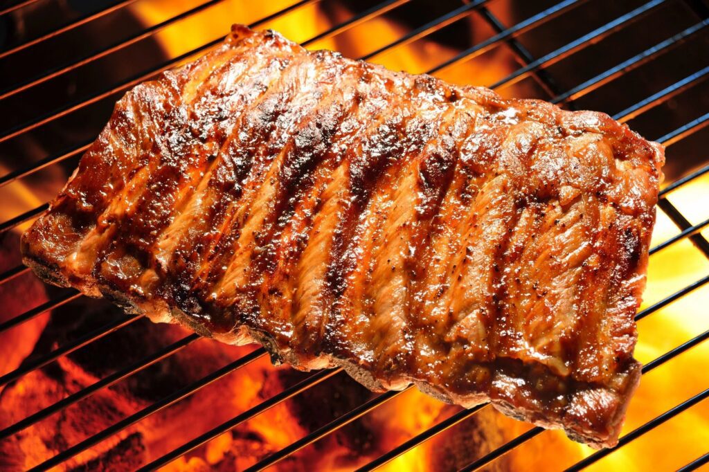 A close up of a piece of meat on the grill